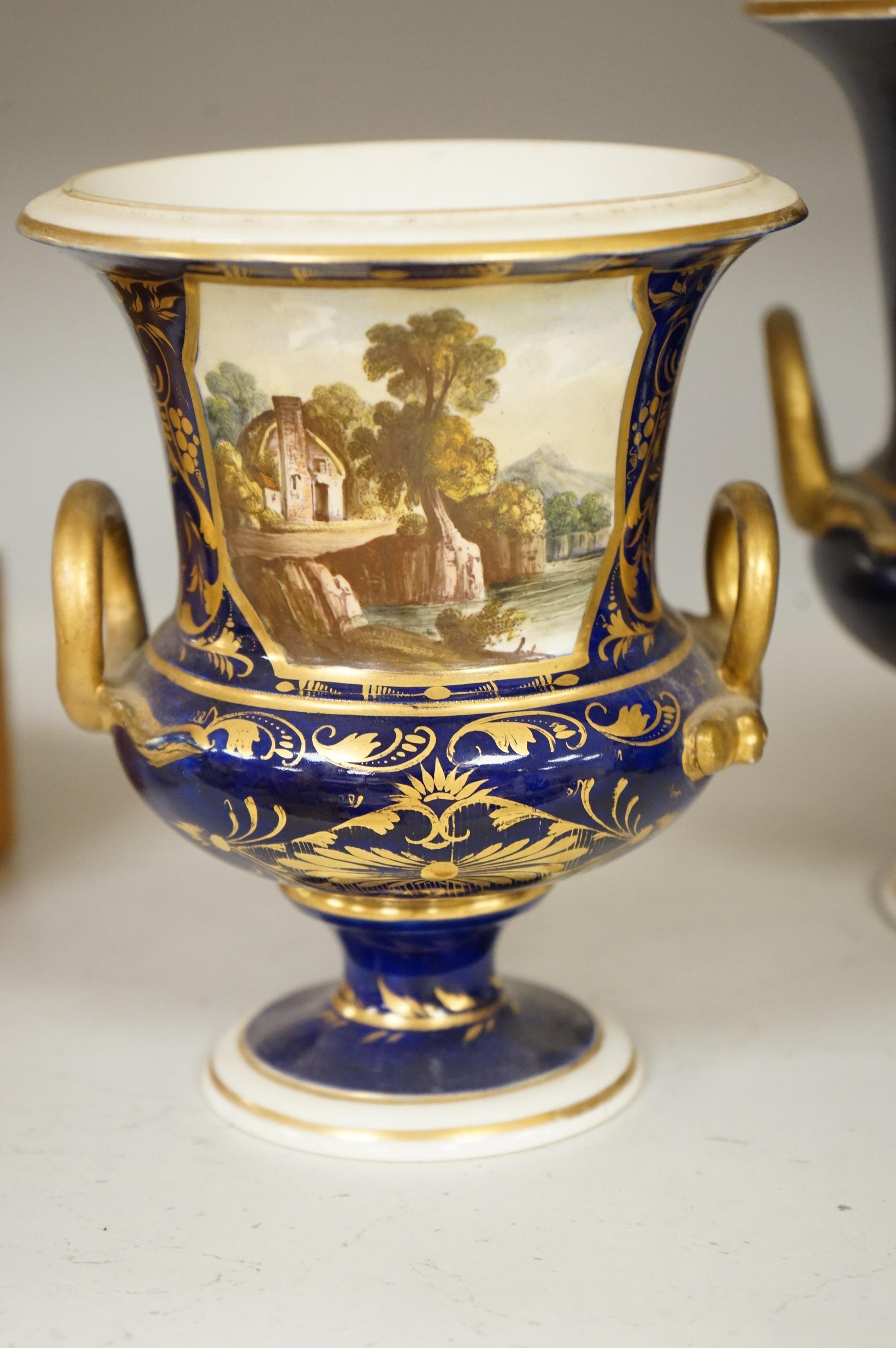A set of three Derby campana vases, painted with named views, circa 1820, tallest 20.5cm